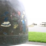 The City of Tacoma recently completed a project to restore the Children's Bell sculpture located along Ruston Way near the shores of Commencement Bay. The four-foot-tall bronze artwork was created in 2000 by artist Larry Anderson in order to celebrate the life, spirit, and accomplishments of Washington PAVE Founder and Director Marty Gentili, who passed away in 1993. The bell is decorated with images of children around the border and is meant to be rung by visitors. In April, area visitors noticed safety barricades were in place around the sculpture while the contractor spent several weeks completing restoration work on the Children's Bell sculpture. (PHOTO BY TODD MATTHEWS)