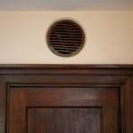 Tacoma architect Stanley Shaw experimented with a number of creative architectural designs in his own home. In the living room, he re-purposed a wooden grille from an old Victrola and installed it above a closet door to provide ventilation for wet coats. (PHOTO COURTESY SUSAN JOHNSON / ARTIFACTS CONSULTING)