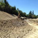 A stretch of 9th Street East, between 190th Avenue East and 198th Avenue East, was reconstructed to enhance safety by re-aligning and regrading the roadway to increase sight distances. The road was closed in June to allow a Pierce County contractor to excavate the site and lay asphalt. The road was re-opened last week, nearly two weeks ahead of schedule. Crews will continue to work along the roadway through September in order to allow crews to complete planting preparation aspects of the project. Periodic lane restrictions are expected during that time. (IMAGE COURTESY PIERCE COUNTY)
