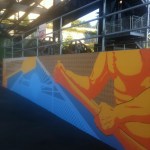 Gig Harbor artist Nick Goettling is creating a mural along Dock Street on the concrete wall of the stormwater collection system below the western side of Tacoma's Murray Morgan Bridge. The mural is expected to be completed this fall. (PHOTO BY TODD MATTHEWS)