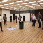 Spaceworks Tacoma Manager Heather Joy leads prospective tenants on a tour of 1120 Spaceworks, a new creative co-working space that will open in a commercial office building in downtown Tacoma. "The building is such a great opportunity for Spaceworks Tacoma because it's right downtown, it's so visible, and it's been vacant for so long," said Joy. "People are excited to hear Spaceworks is doing something like this." (PHOTO BY KRIS CREWS / COURTESY SPACEWORKS TACOMA)