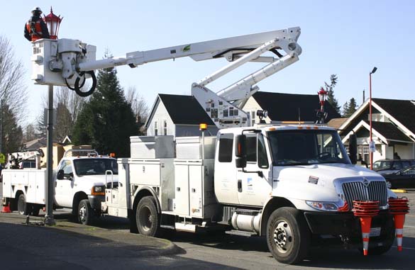 Crews are installing light-emitting diode (LED) street lights in Tacoma's Lincoln International Business District this week. (PHOTO BY TODD MATTHEWS)