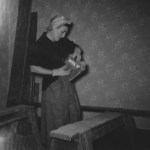 Former Mead House property owner Paula Keyser doing home improvement work in 1956. Paula and her husband, Bill, owned the home for more than 40 years and filled it with material salvaged from some of Tacoma's most historically significant buildings before the structures were demolished. (PHOTO COURTESY SUSAN JOHNSON / ARTIFACTS CONSULTING)