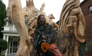 Local painter, illustrator, and chainsaw sculptor Bruce 'Thor' Thorsteinson was hired last year to turn a dead maple tree in Tacoma into a work of art. (FILE PHOTO BY TODD MATTHEWS)