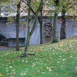 Harold Balazs's "Untitled (Concrete Sculpture)" is seen through the trees at Bicentennial Pavilion in downtown Tacoma. Citing safety concerns, the City of Tacoma plans to remove the 40-year-old sculpture. (PHOTO BY TODD MATTHEWS)
