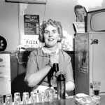 A bartender at Seattle's Bohemian Club Tavern circa 1956. (ELMER OGAWA PHOTOGRAPH / COURTESY UNIVERSITY OF WASHINGTON SPECIAL COLLECTIONS)