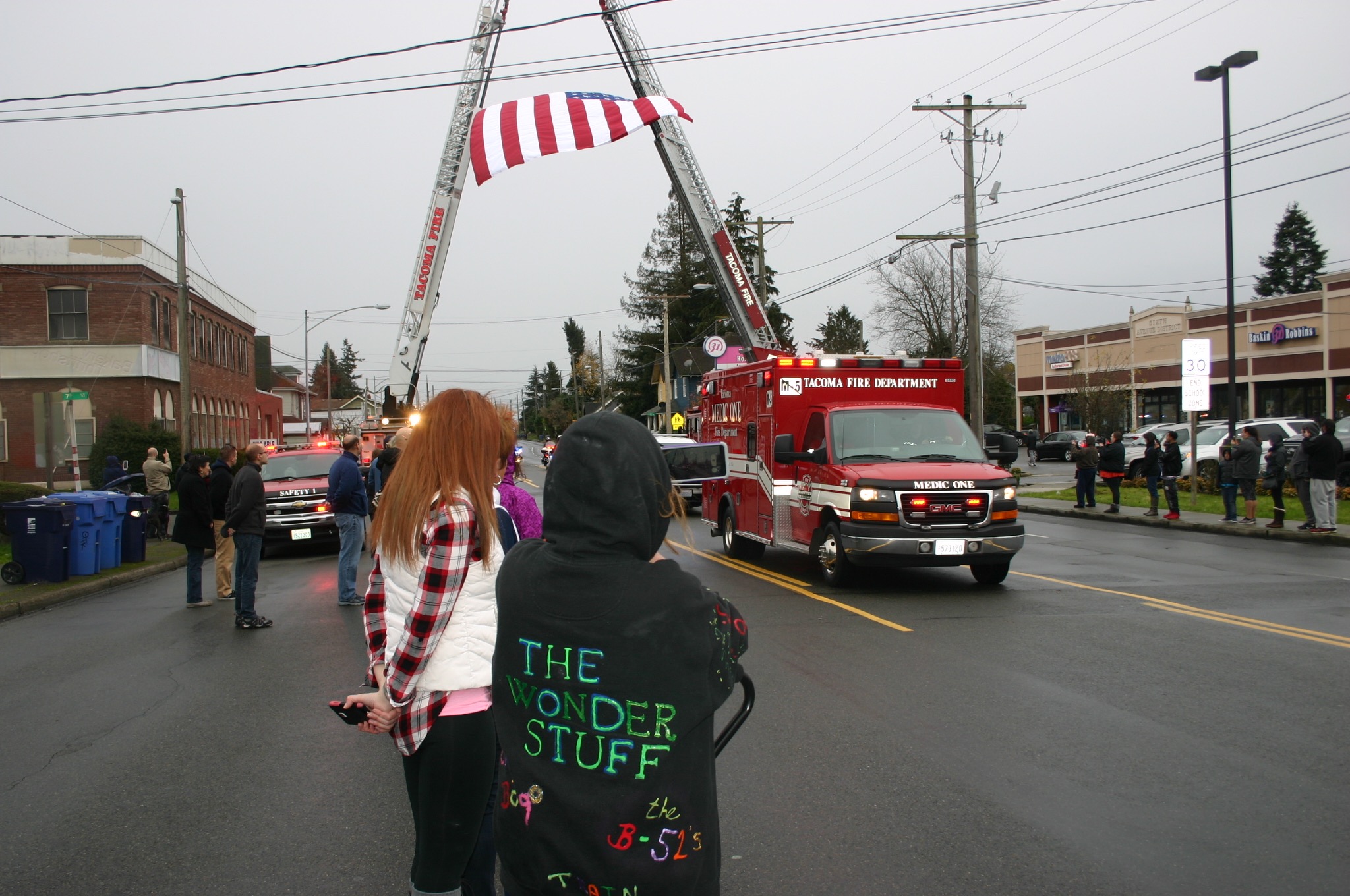 Credit: David Guest / TDIPeople line South Sprague Ave., Friday, Dec. 2, to pay their respects to Tacoma Police Officer Jake Gutierrez, who was shot to death on Dec. 1 while responding to a domestic violence call.