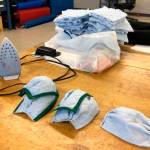 Completed surgical masks are displayed at the aviation survival technician&rsquo;s shop at Coast Guard Sector North Bend, Oregon, April 10, 2020. Manufacturing the masks is meant to bolster supplies for the community first responders in preparation of the fight against COVID-19. (Photo by Petty Officer 3rd Class Trevor Lilburn, Photo courtesy of U.S. Coast Guard Sector North Bend)