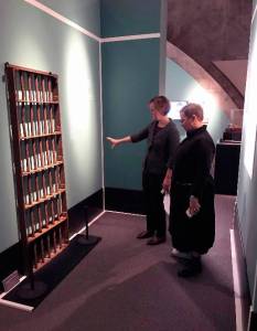 Washington State Historical Society Director Jennifer Kilmer and Director of Audience Engagement Mary Mikel Stump stand in a space representing the size of a prison cell from McNeil&rsquo;s Territorial prison days. Image courtesy Washington State Historical Society