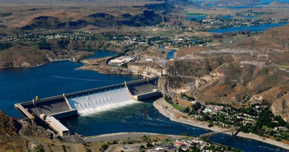 June 30, 2011: Aerial view of Grand Coulee Dam releasing downstream an unusually large and late spring time water flows of over 200,000 cfs. Broken out, it&rsquo;s 33,800 cfs, over the spillway and 167,000 cfs through the hydropower generators. Image courtesy Bureau of Reclamation