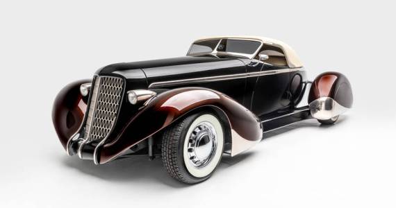 SLOW BURN
SPECS: 1936 AUBURN 852 BOATTAIL SPEEDSTER (MODERN REPLICA) BUILDER: RICK DORE KUSTOMS INTERIOR: EGYPTIAN LEATHER BY BOB DEVINE/RICK DORE ENGINE: 350-CUBIC INCH CHEVROLET V-8
<em>Image courtesy LeMay-Americas Car Museum, Petersen Automotive Museum and the Hetfield Family</em>
Bio: Slow Burn was crafted from an official Glen Pray recreation of an Auburn Boattail. The fiberglass body made it difficult to alter extensively, so Hetfield and Dore instead added details, like a sloped, Carson-style convertible top, to emphasize the cars curving lines. The root beer paint color of the fenders, in contrast with the darker body color, highlights their sinuous shape. Accents like the geometric grille, taillight trim, and personally designed wheels exemplify Hetfields personal style.