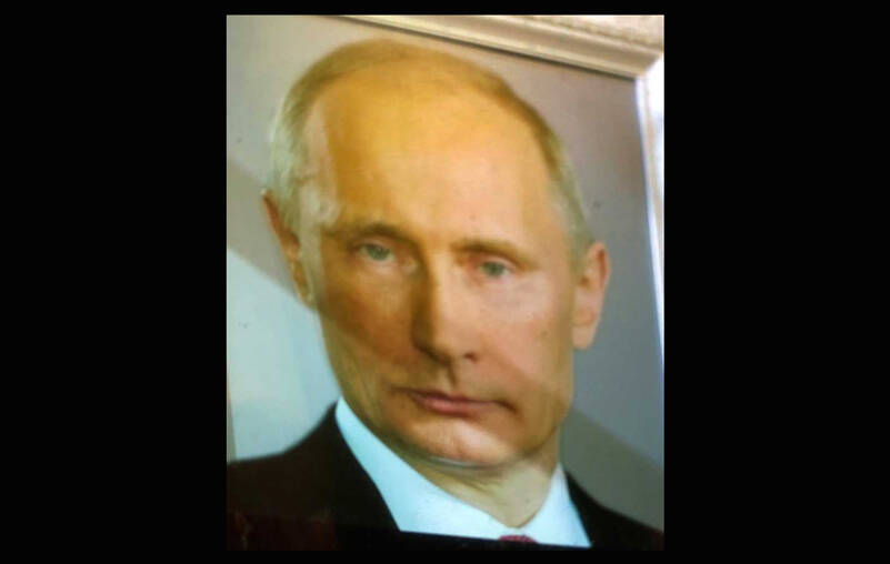 Russias President Putin dominated global headlines in the final days of February as the world wondered what he wanted and what he was willing to pay to get it. The diagonal line across the face is an accidental shadow. Or is it? (Photo by Morf Morford)