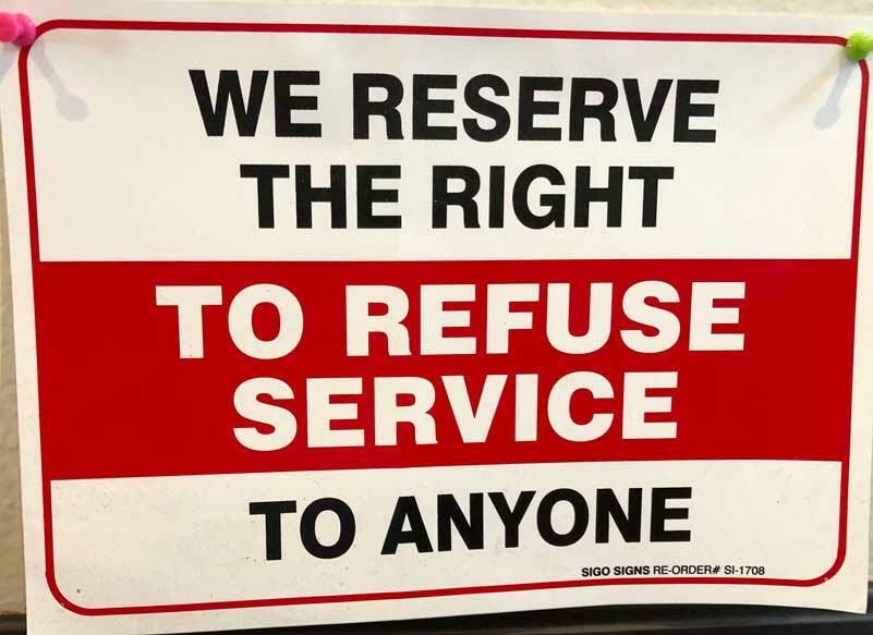 Ive never understood this sign. Isnt any shop in the business of providing - not refusing - a good or service? Who is the intended audience for this sign? Who is welcome? Who isnt? (Photo by Morf Morford)