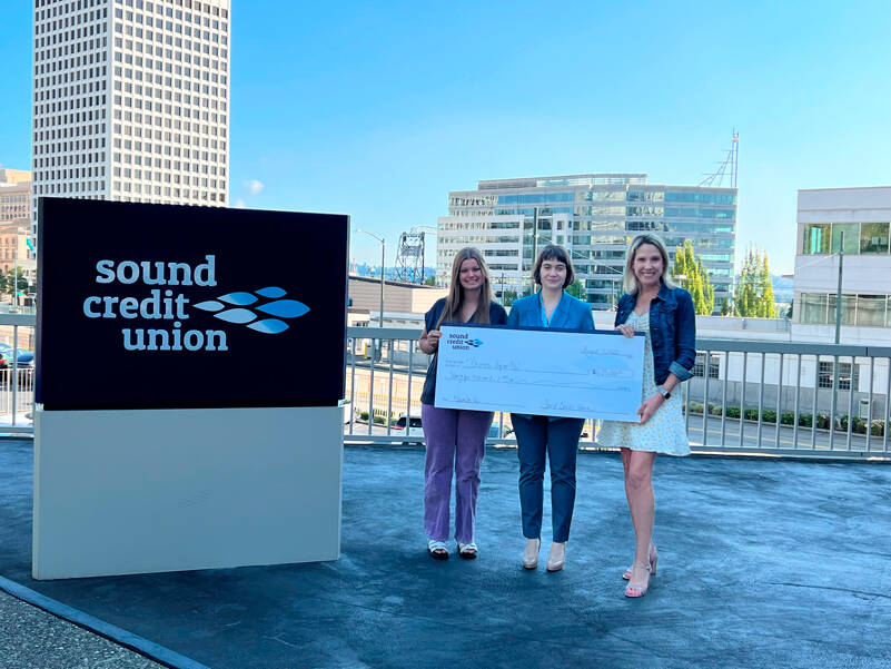 Sound Credit Unions annual charity auction benefits Business Impact NW this year. Individuals in the photo are, from left to right: Halle Fort, Community Relations Ambassador at Sound Credit Union Greta Stough, Chief Strategic Officer at Business Impact NW Jennifer Reed, VP/Marketing at Sound Credit Union Image courtesy Sound Credit Union