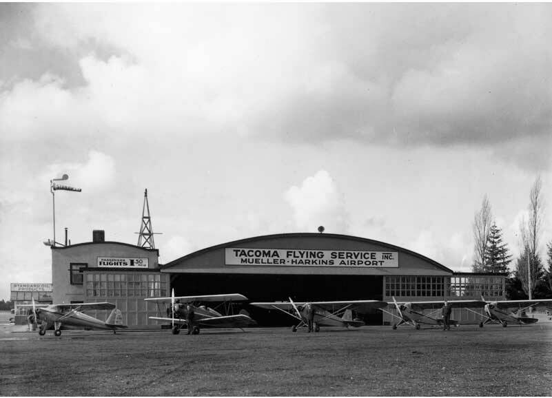 This Tacoma Flying Service Hangar, built in the 1920s, is still standing and is currently being used as a large workspace by Clover Park Technical College. Photo (circa 1940s) courtesy Northwest Room at The Tacoma Public Library, Richards Studio D9405-2.
