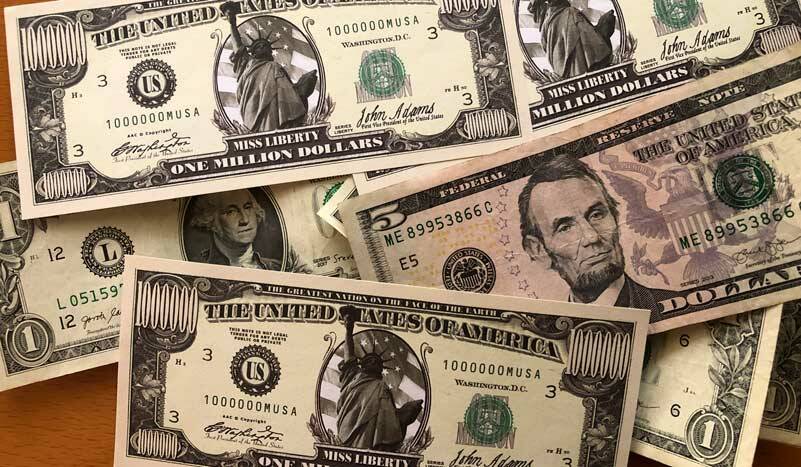 <strong> </strong>A pile of cash at my desk. (Photo by Morf Morford)