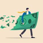 Lose money investment in financial crisis, profit and loss in business or deflation and inflation concept, businessman holding big dollar banknote money while loss, crumble and reduce in value.