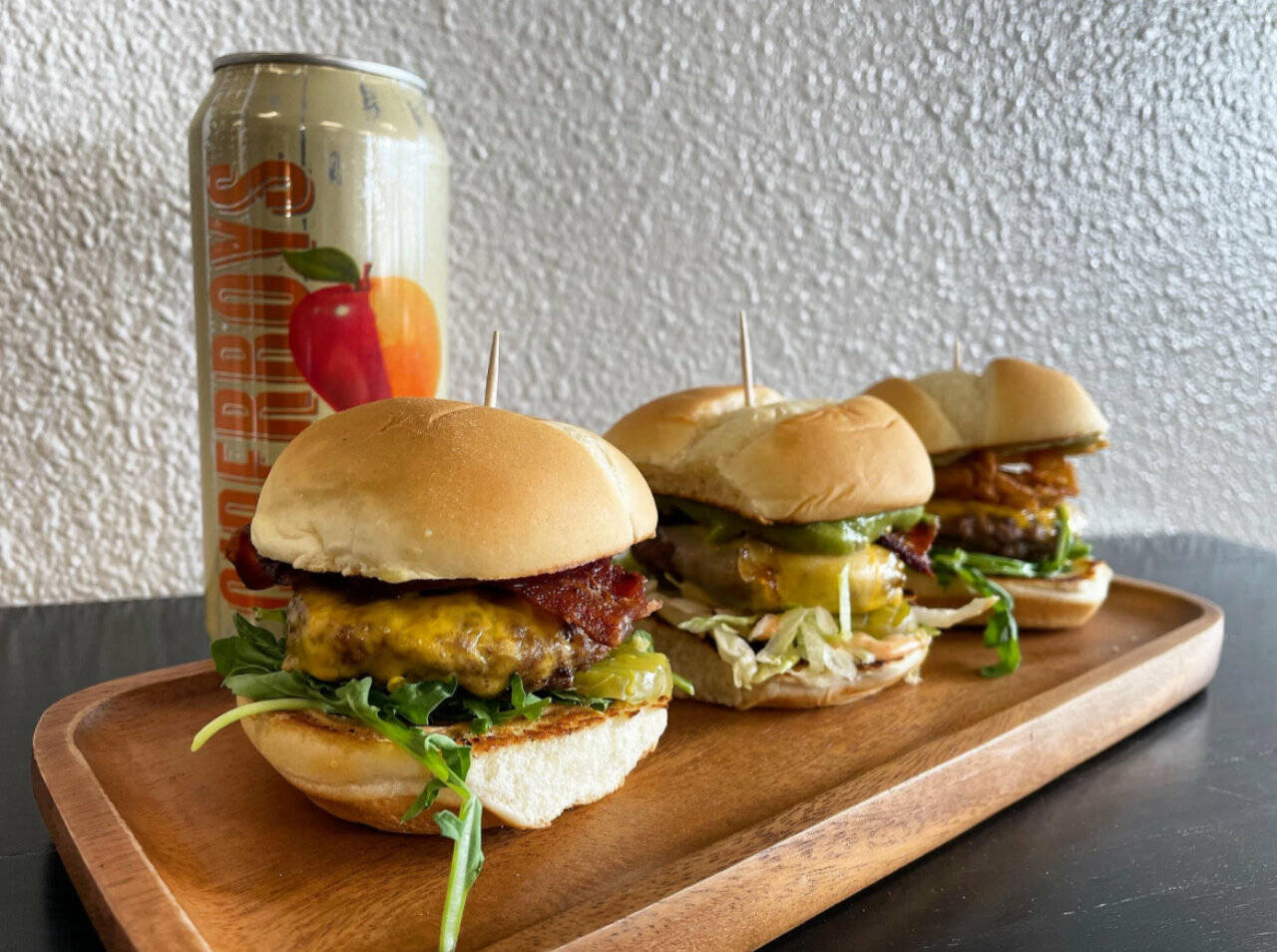 The picture with the 3 burgers and a can is their Spanaway location (there was no comment on who to give credit for this picture) and I asked verbally initially and via an email for her to send the pics. & menu to.