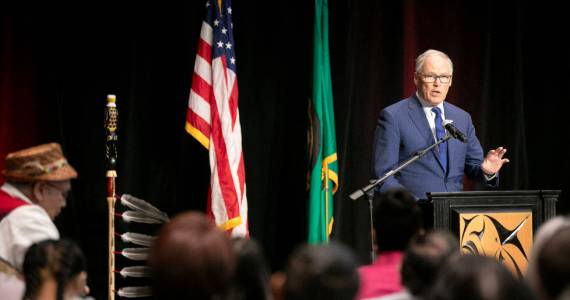 Gov. Jay Inslee addresses a packed room before signing a number of bills into law on Tuesday, March 19, 2024, at Tulalip Casino’s Orca Ballroom in Tulalip, Washington. (Ryan Berry / The Herald)