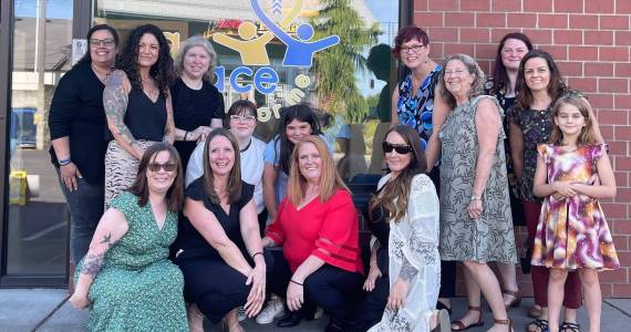 Photo courtesy of Alisha Vilela 
Alisha Vilela, center, outside A Place for Me in Tacoma.