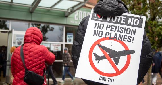 Olivia Vanni / Sound Publishing
Larry Best, a customer coordinator for quality assurance who has worked at Boeing for 38 years, stands outside of Angel of the Winds Arena with a vote no sign on Monday in Everett.