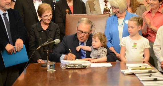 Office of the Governor 
Gov. Jay Inslee signs legislation in 2017 creating the Department of Children, Youth and Families.