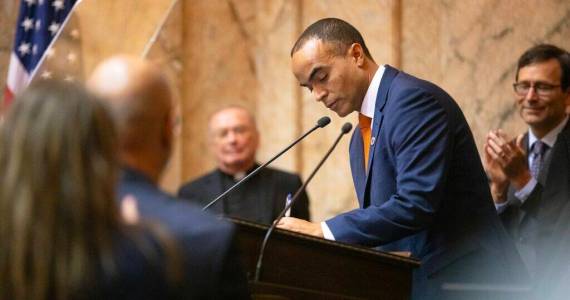 Attorney General Nick Brown signs his election certificate after being sworn in Wednesday, Jan. 15, 2025, at the Washington State Capitol in Olympia, Wash. (Ryan Berry/Washington State Standard)