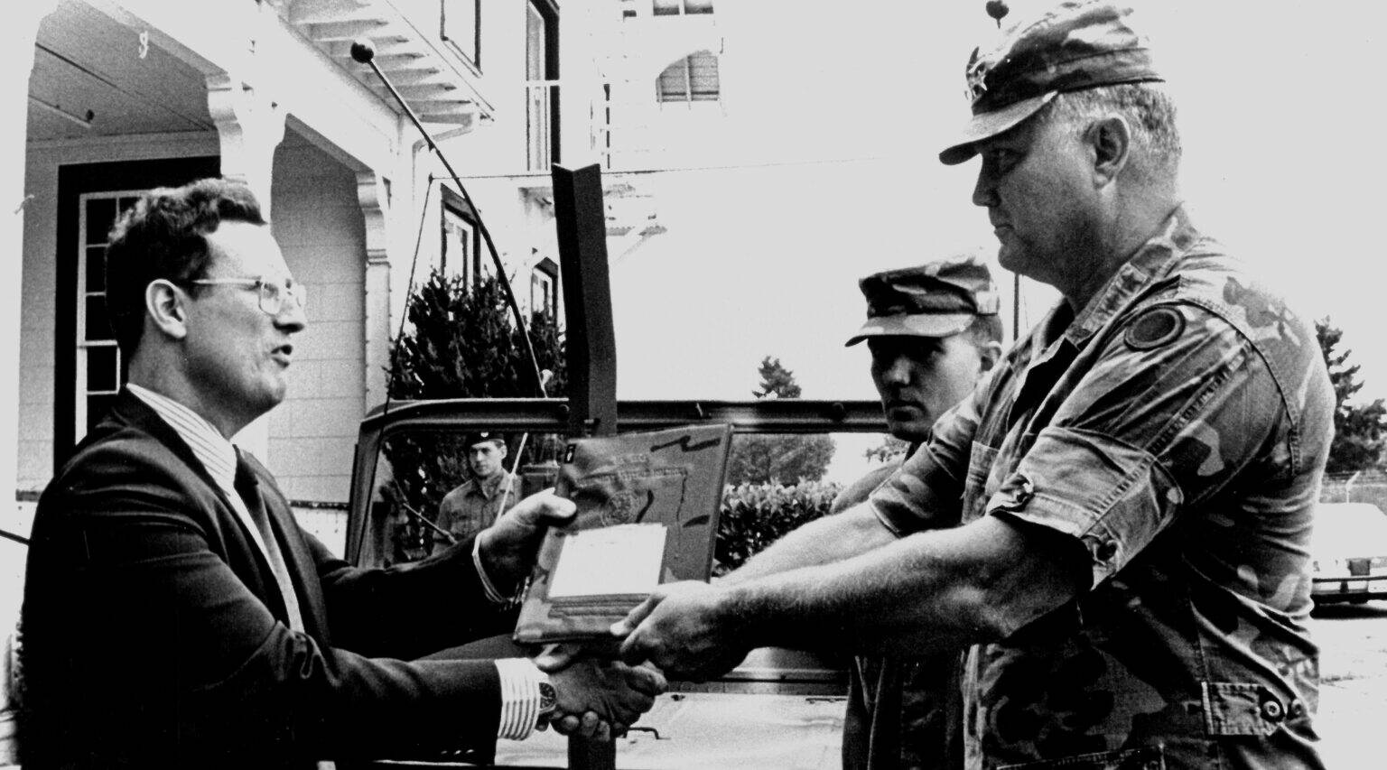 Norman Schwarzkopf, then a lieutenant general, transfers his command jeep to Alan Archambault, director of the Lewis Army Museum, in 1987. (Photo courtesy of Alan Archambault)