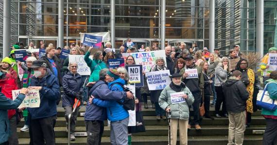 Opponents of President Donald Trumps executive order indefinitely halting refugee resettlement in the U.S. rally on the steps of the federal courthouse in Seattle on Feb. 25, 2025, after a judge issued a ruling blocking the presidents order. (Photo by Jake Goldstein-Street/Washington State Standard)