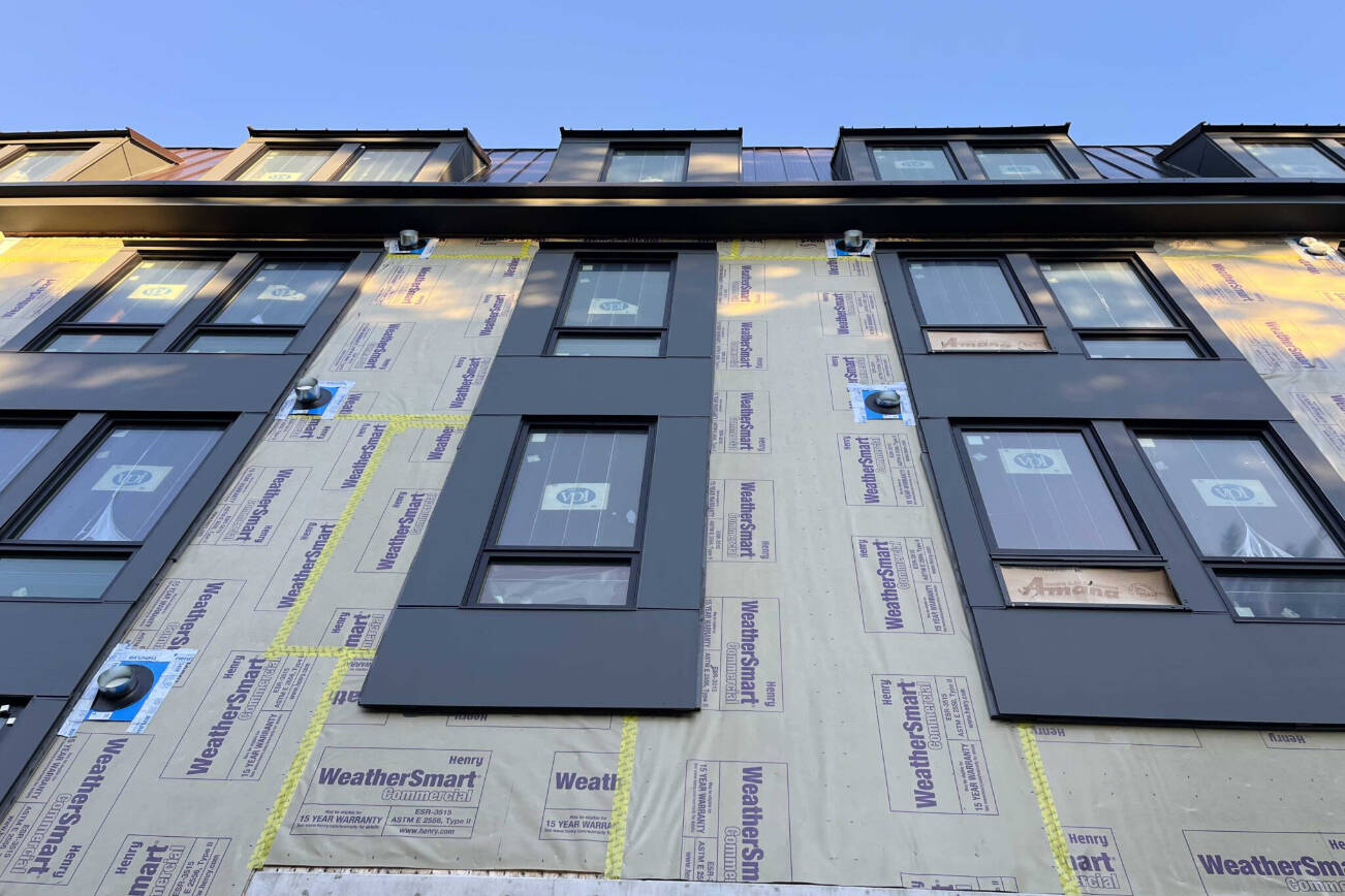 An apartment building under construction in Olympia, Washington in January 2025. Critics of a proposal to cap rent increases in Washington argue that it could stifle new development. (Photo by Bill Lucia/Washington State Standard)